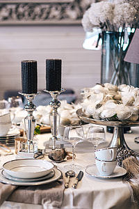 Fancy restaurant dinner table decorated with quail eggs and feathers thumbnail