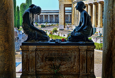 two women statue near pedestal at daytime photo thumbnail