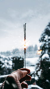 person holding firecracker thumbnail