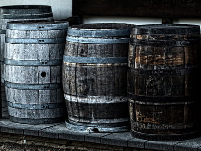 four gray wooden barrels thumbnail