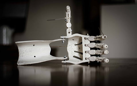 close-up photo of white sewing machine parts thumbnail