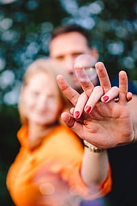 Young couple holding hands outdoors thumbnail