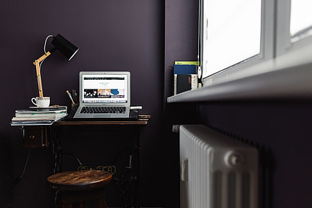 Contemporary home office idea with dark walls thumbnail