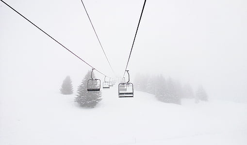 black cable car on top of ice covered hill thumbnail