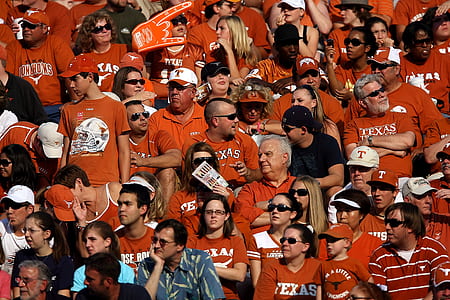 group of people wearing red shirts during daytime thumbnail