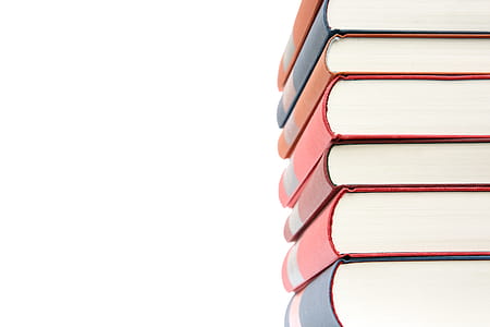 Pile of Red and Blue Hardbound Books thumbnail