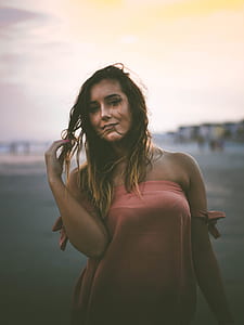 woman touching her hair smiling for a photo shoot thumbnail