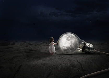 girl touching bulb with moon reflection thumbnail