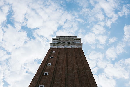 low-angle photography brown building thumbnail