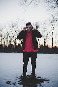 man standing on snow field thumbnail
