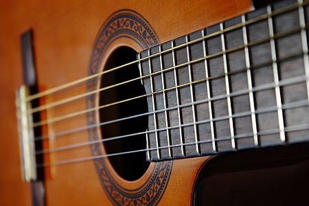 selective focus photography ofguitar string and fret thumbnail