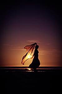 silhouette of woman holding textile thumbnail
