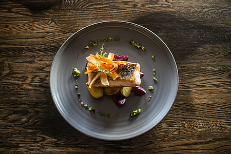 top-view photography of grilled meat with slice vegetables on gray ceramic plate thumbnail