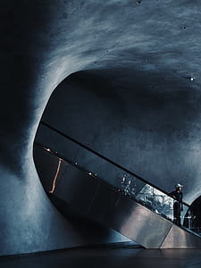 photo of person riding escalator thumbnail