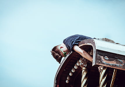 man on the roof reaching pillar thumbnail