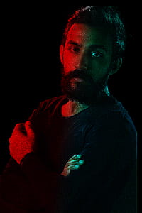 Man in Black Crew-neck Sweatshirt Posing for a Photo thumbnail