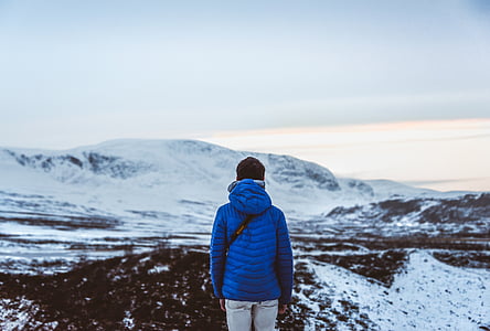 man standing on mountain with snow thumbnail