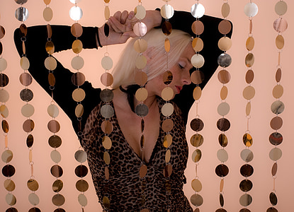 woman in black and brown leopard pattern neck long-sleeved shirt thumbnail