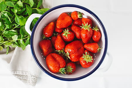 strawberry on white ceramic bowl thumbnail