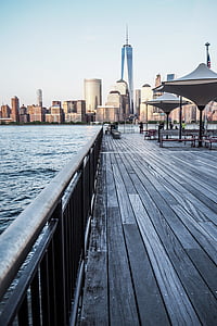 sea docks near city buildings thumbnail