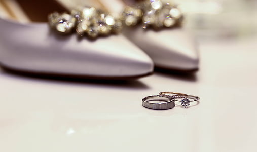 silver-colored ring next to pair of silver shoes thumbnail