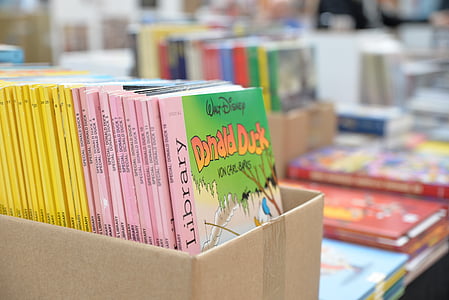 selective focus photography of Walt Disney books inside box thumbnail