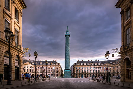 blue tower under cloudy sky thumbnail