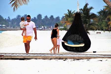 girl and woman standing near egg hanging chair thumbnail