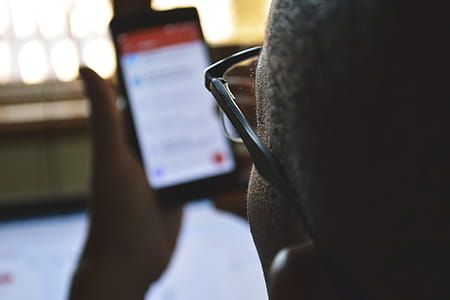 Man Using Phone Online thumbnail