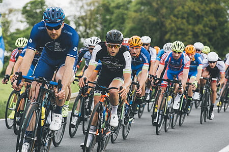 group of bicycle riders on asphalt road thumbnail