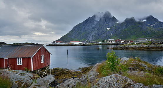 red cabin near mountain as background thumbnail