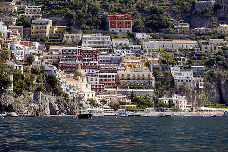 body of water near buildings and houses thumbnail