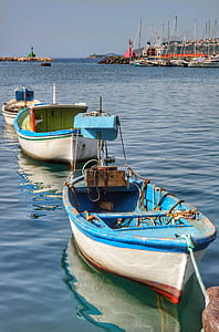 three boats on body of water thumbnail