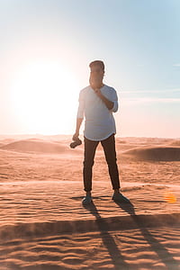 man holding DSLR camera thumbnail