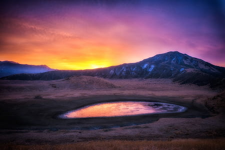 oasis near mountain during sunset thumbnail