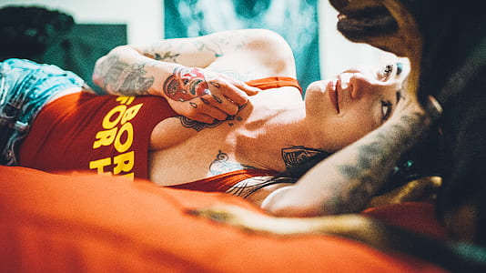 lying woman wearing red tank top thumbnail