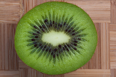 sliced green fruit on top of brown surface thumbnail