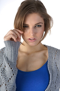 Person wearing holding tip of her hair thumbnail
