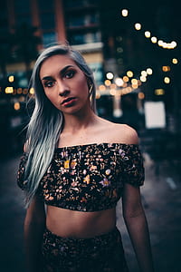 woman with black and yellow floral crop top thumbnail