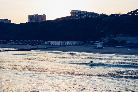 Surfing at sunset thumbnail