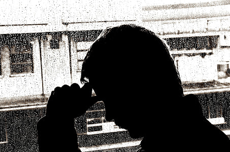 silhouette of man beside window panel thumbnail