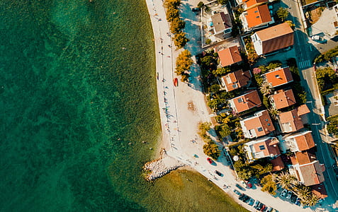 aerial photography of town house near beach thumbnail
