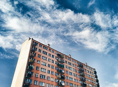 brown building under blue sky dat at daytime thumbnail