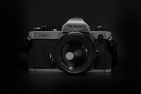 Nikon DSLR camera against black background thumbnail