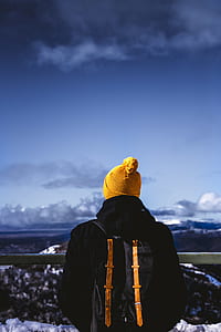 man wearing yellow bobble hat thumbnail