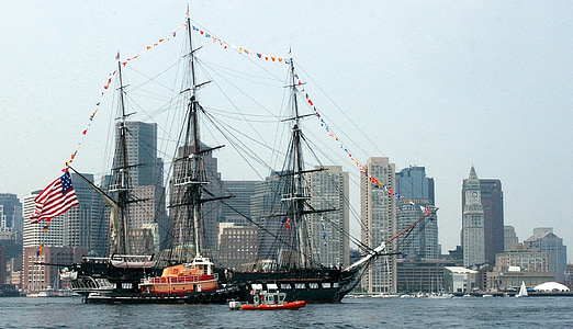ship on body of water near buildings thumbnail