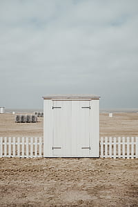 photo of white wooden shed beside white fence thumbnail