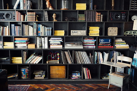 book lot on black wooden bookshelf thumbnail