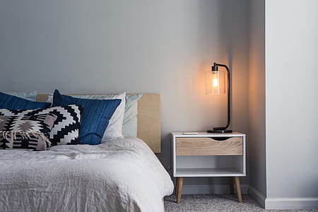 brown and white wooden nightstand with table lamp thumbnail