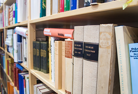 selective focus photo of hardbound book on bookshelf thumbnail